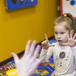 Finger play with a child to develop memory